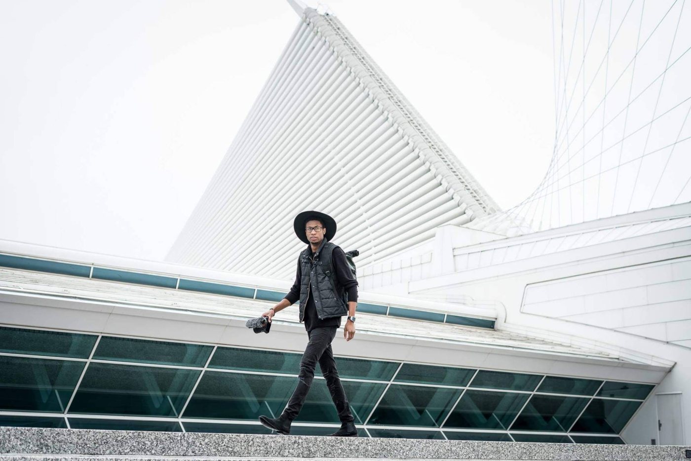 Walking outside the Milwaukee Art Museum with a camera